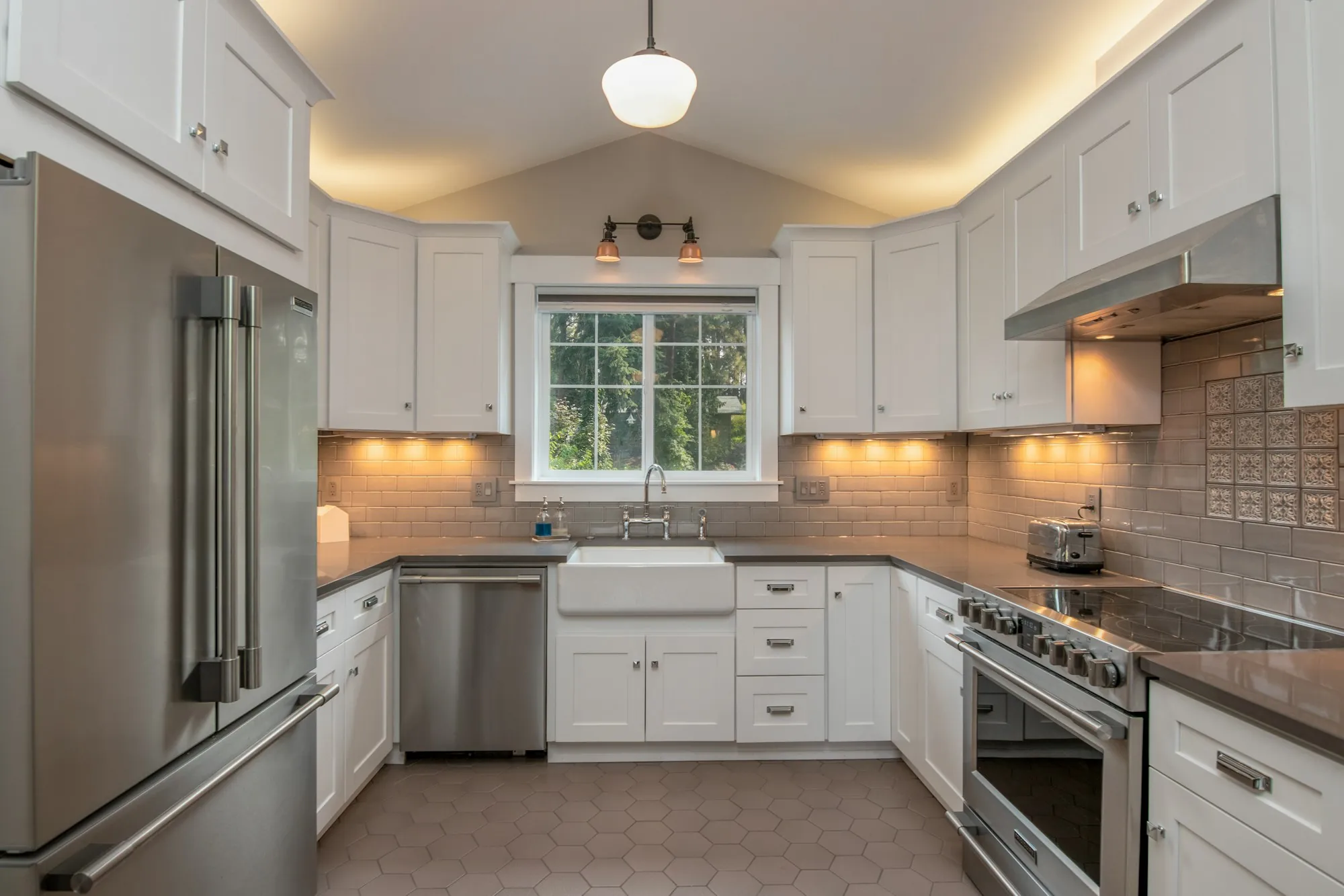 Kitchen island with pendant lights and bar seating