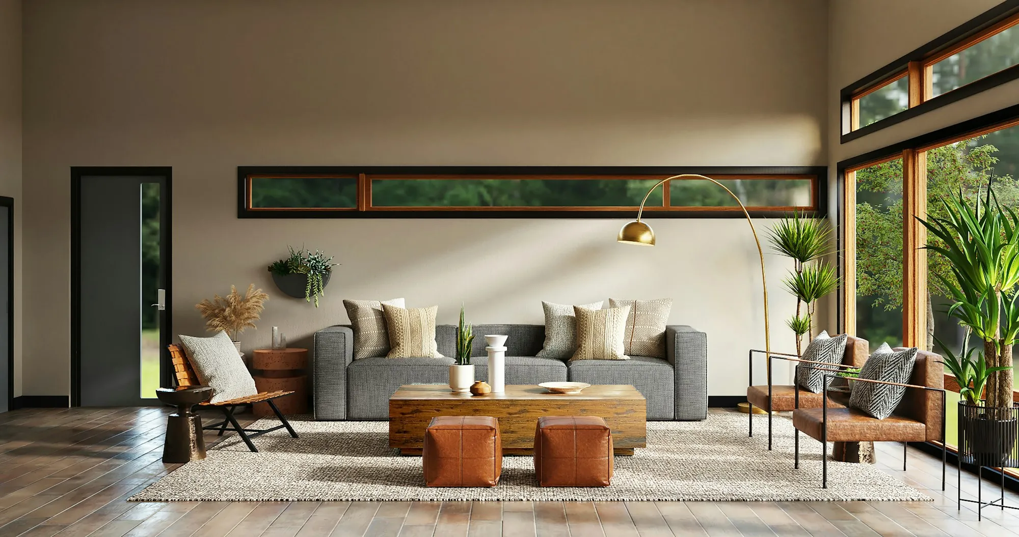 Renovated open living room with clerestory windows, a gray sofa and leather accent chairs